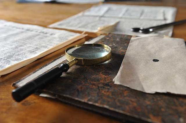 magnifying glass, sheet, writing desk