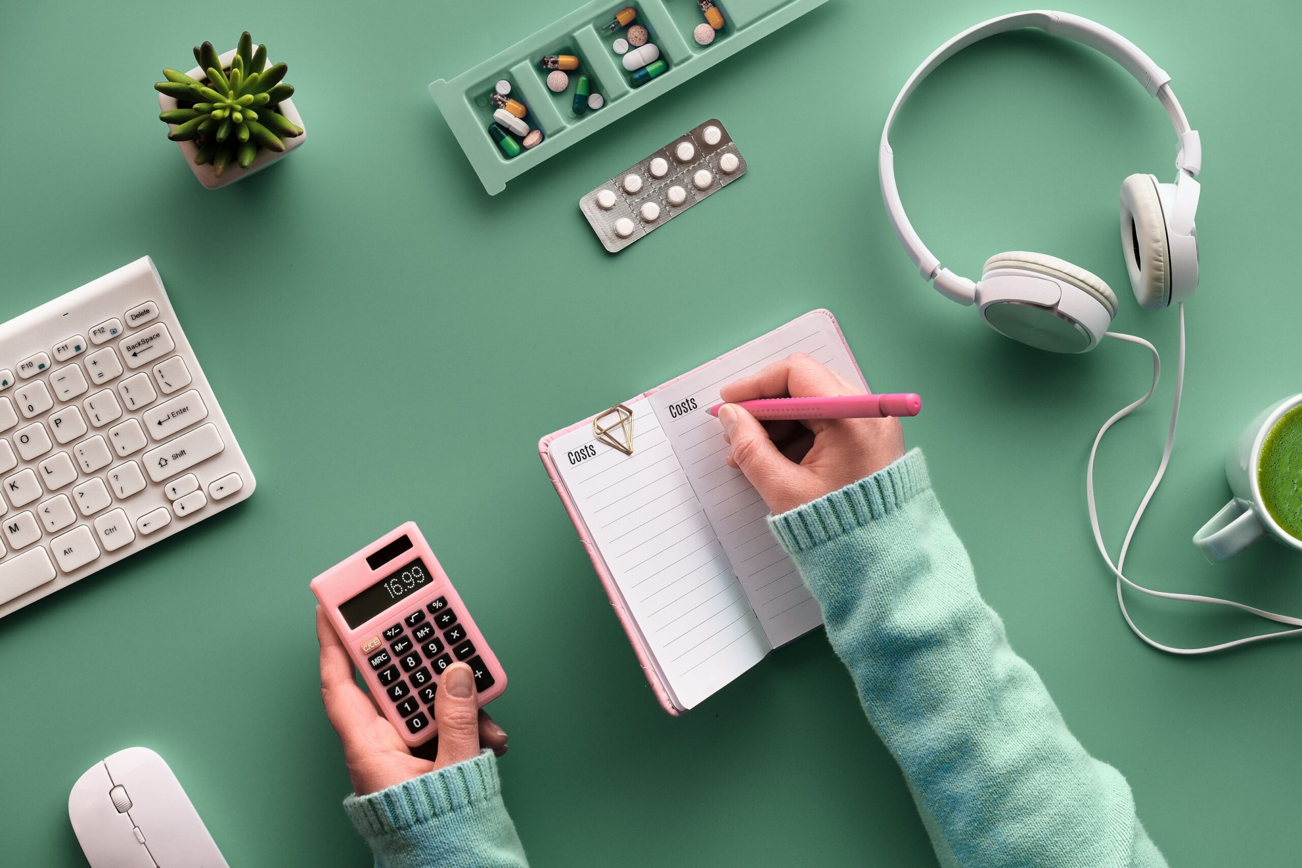 Calculating flu medication cost with a calculator and a notepad