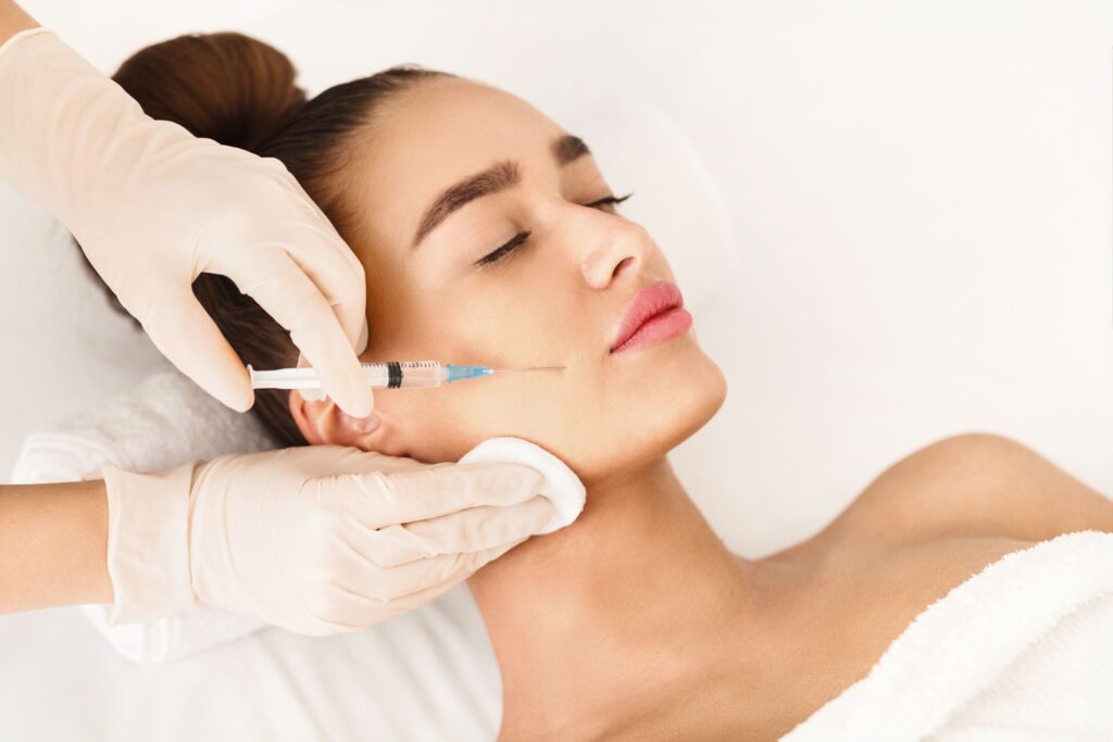 Women receiving botox injection