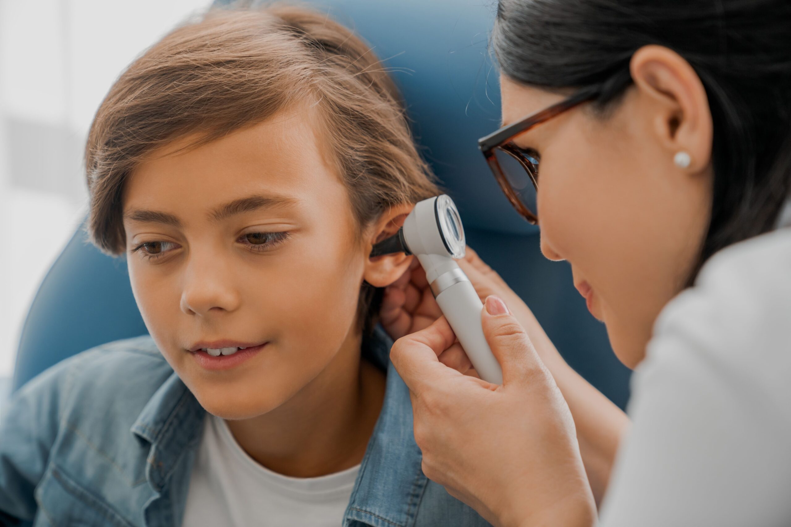 Illustration of a healthcare provider examining a child's ear