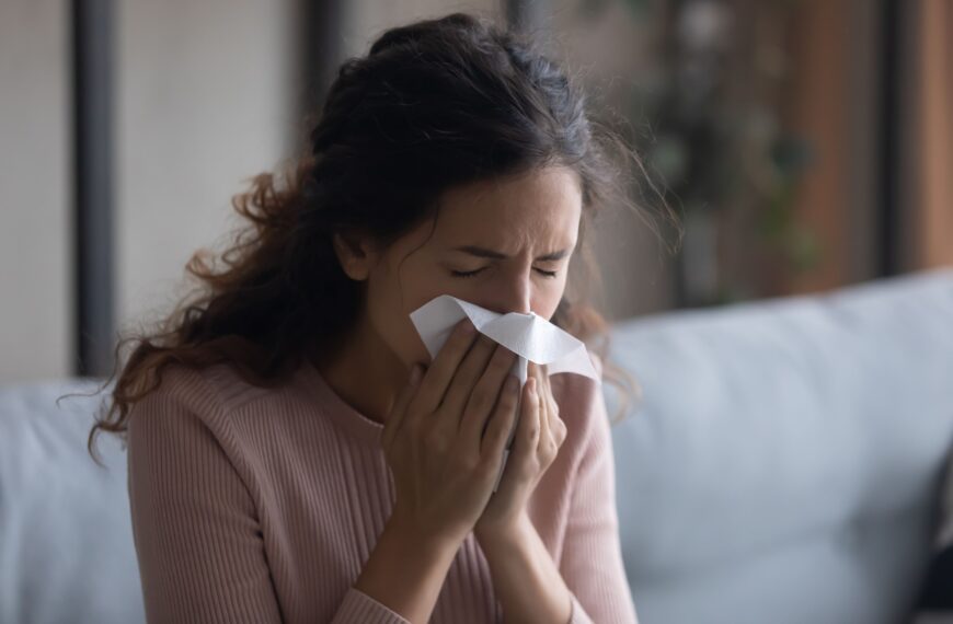 Woman experiencing allergy symptoms