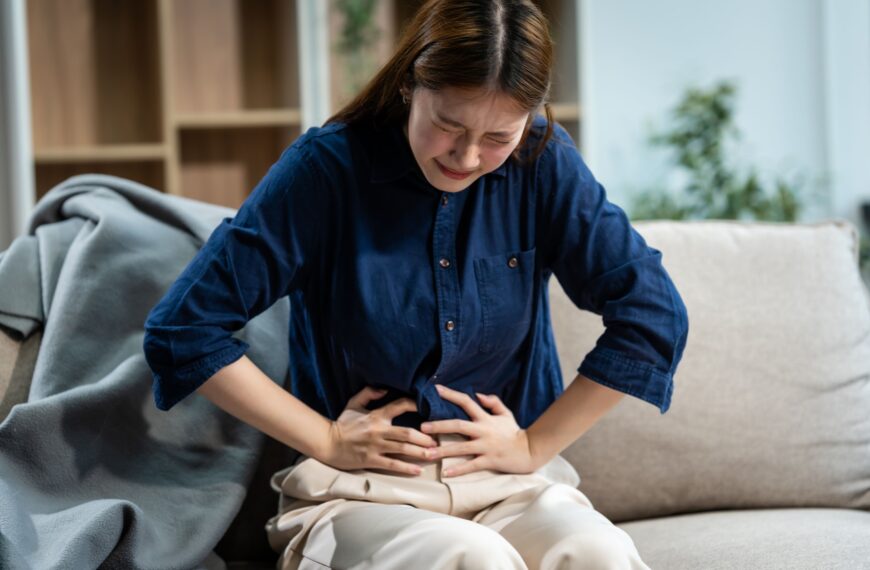 Woman suffering from constipation