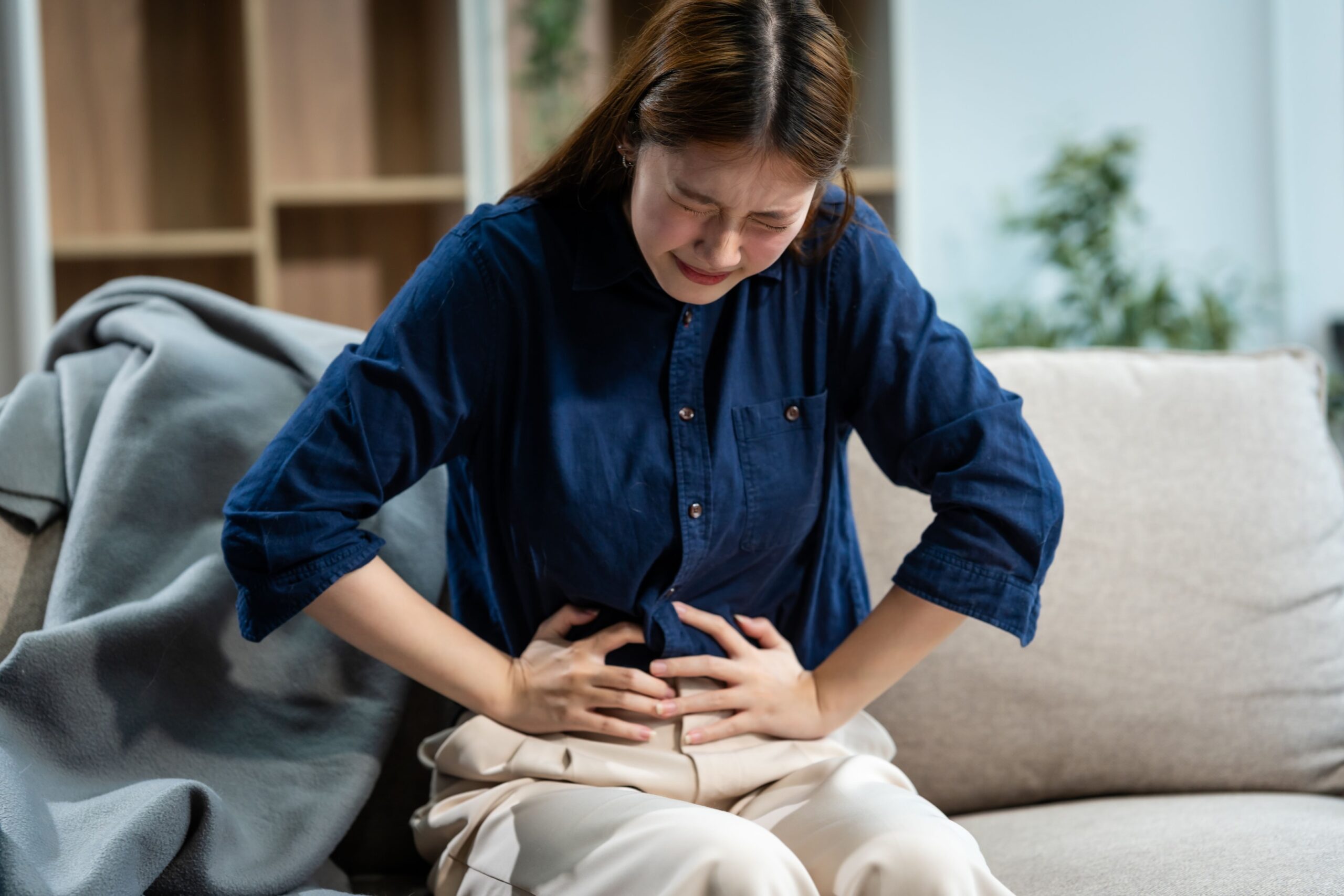 Woman suffering from constipation